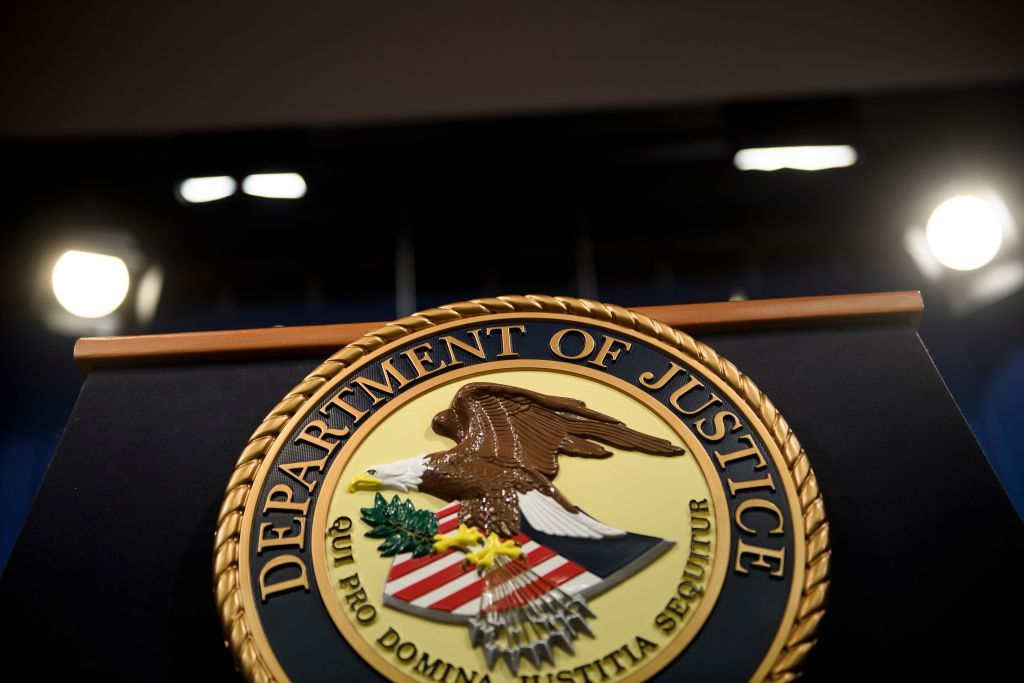 The Department of Justice seal.