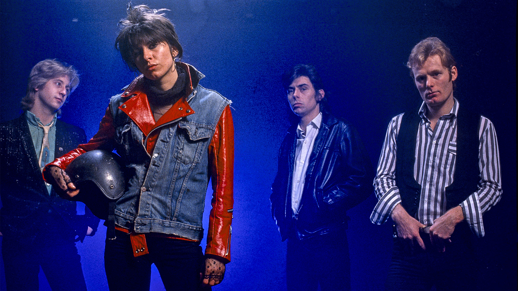 Posed studio group portrait of the Pretenders in 1979 L-R James Honeyman Scott, Chrissie Hynde, Pete Farndon and Martin Chambers 