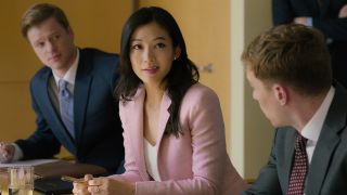 Arden Cho in pink blazer in Partner Track Netflix series