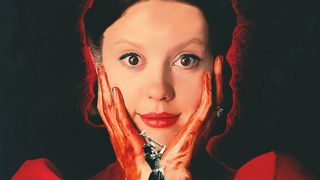 Mia Goth as Pearl, with her hands covered in blood pressed against her face, in the poster for Pearl.