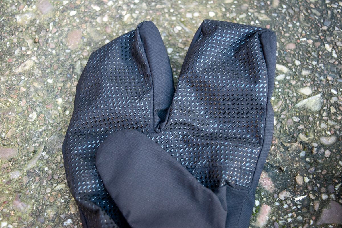 Black Sportful lobster gloves on some concrete