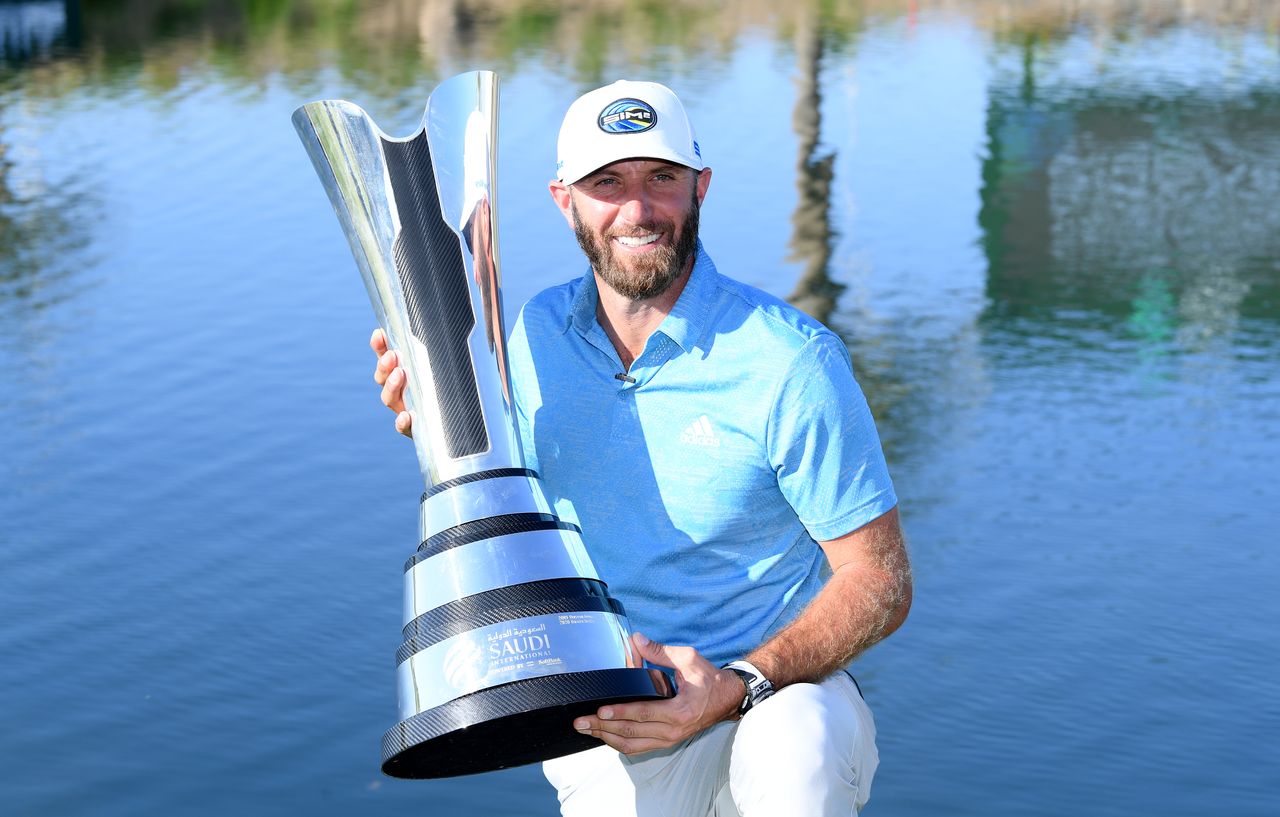 Dustin Johnson with the 2021 Saudi International trophy