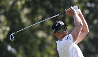 Henrik Stenson hits an iron shot