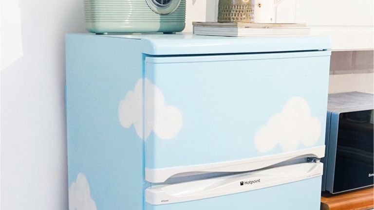 Blue painted fridge with clouds