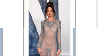 Alessandra Ambrosio wears a silver sheer dress as she attends the 2023 Vanity Fair Oscar Party hosted by Radhika Jones at Wallis Annenberg Center for the Performing Arts on March 12, 2023 in Beverly Hills, California