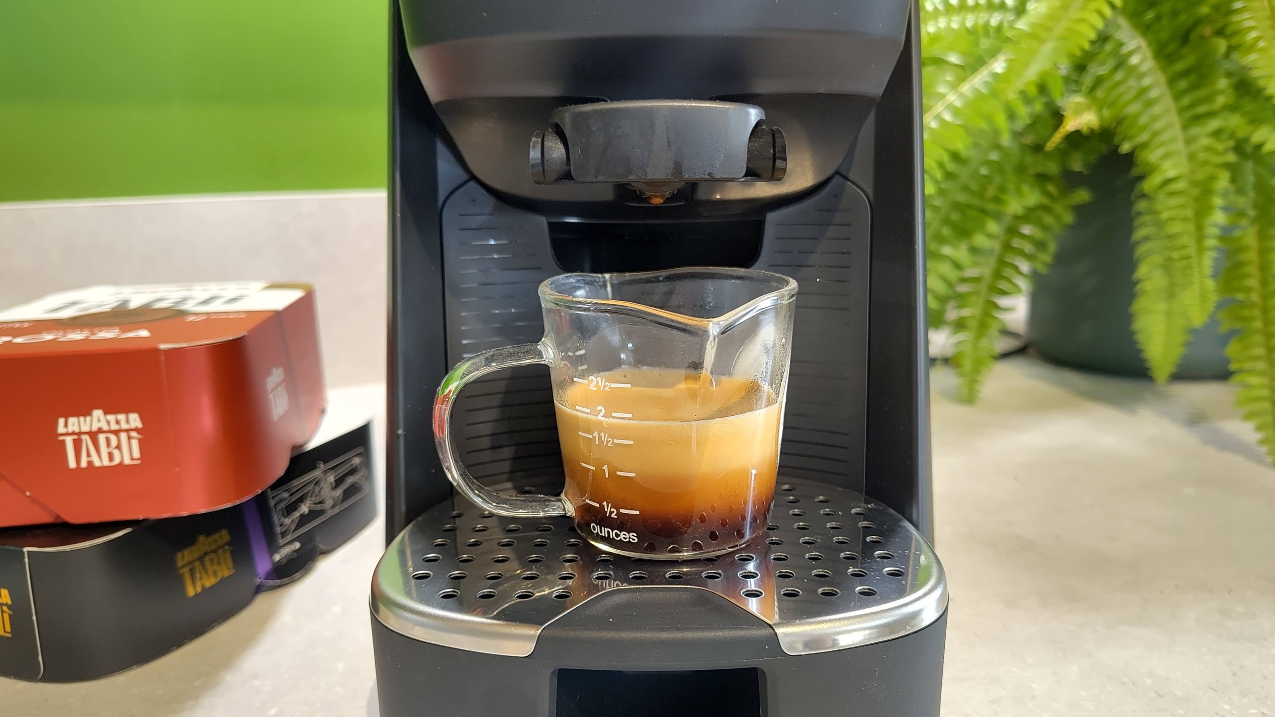Lavazza Tabli coffee machine with freshly dispensed espresso