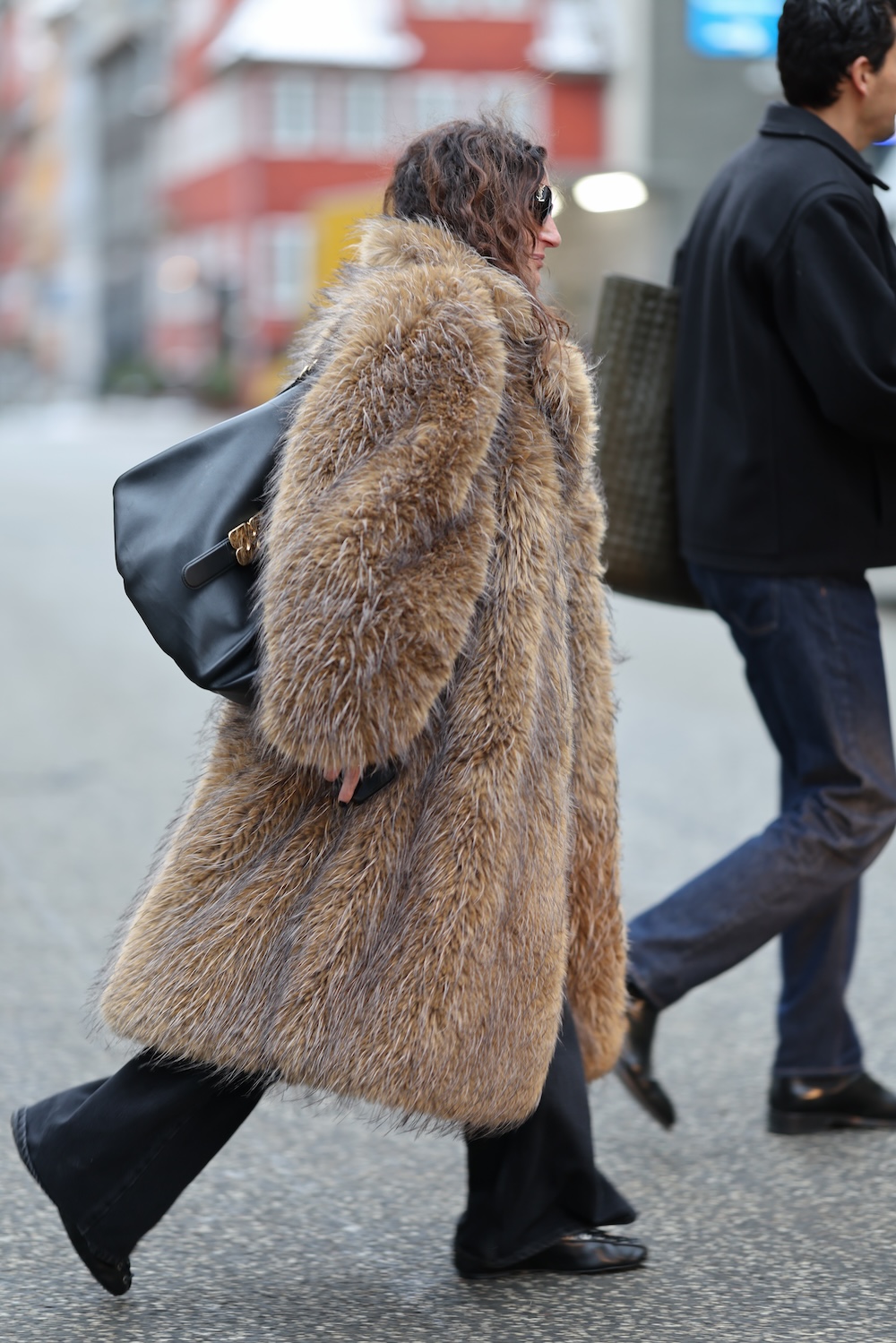 models at copenhagen fashion week wearing fur coats and colorful coats
