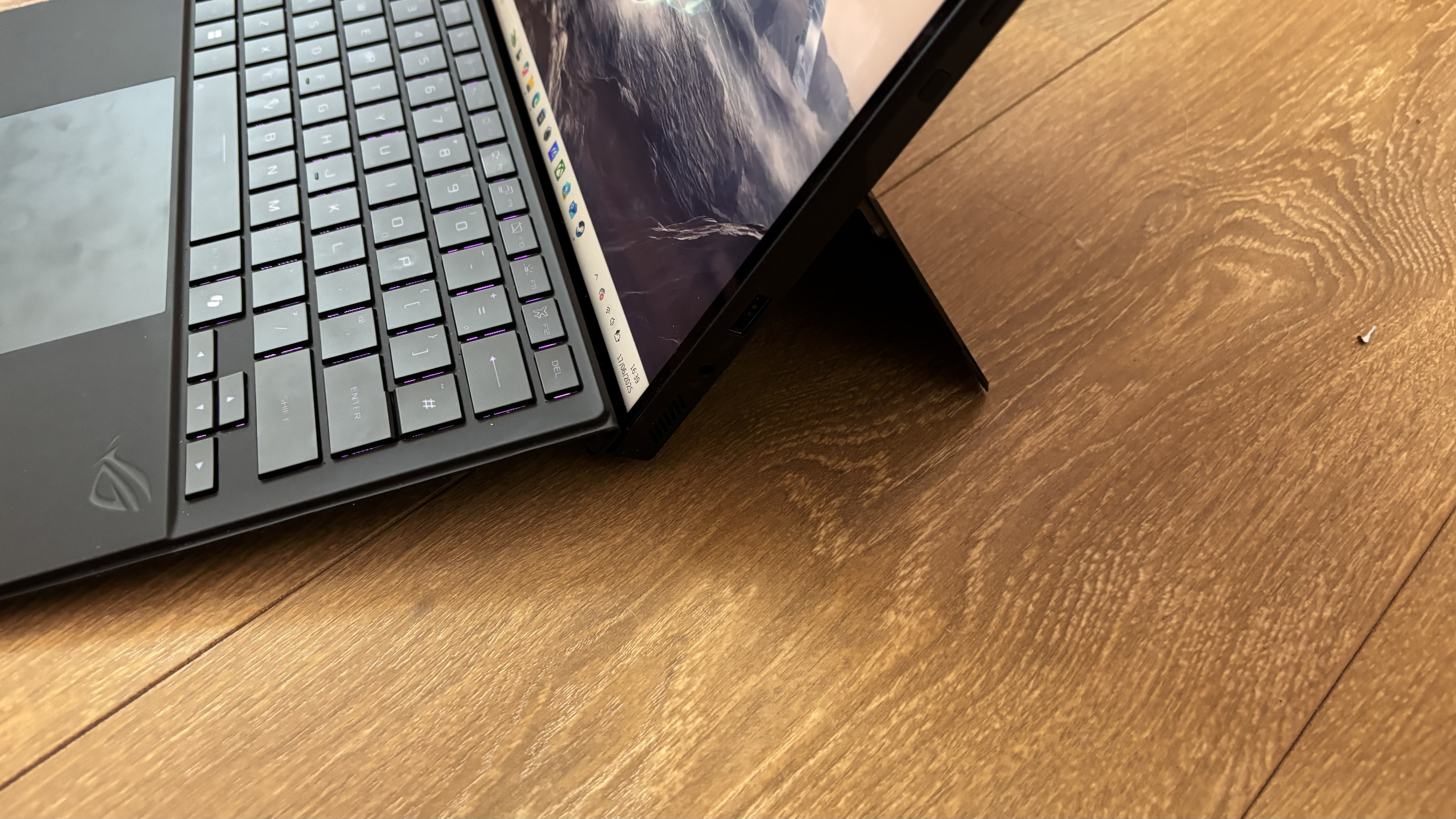 Asus ROG Flow Z13 gaming tablet on wooden surface