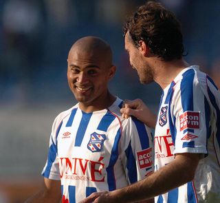 Afonso Alves is congragulated by a Heerenveen team-mate after scoring seven goals against Heracles Almelo in October 2007.