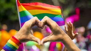 Pride flags and hands in a heart