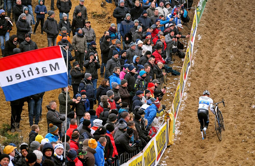 Mathieu van der Poel running up the san hill at Superprestige Zonhoven