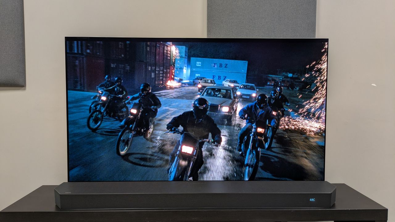 Hard Boiled 4K Blu-ray on LG G6, showing a convoy of motorcycles and a bank driving through a docks at night
