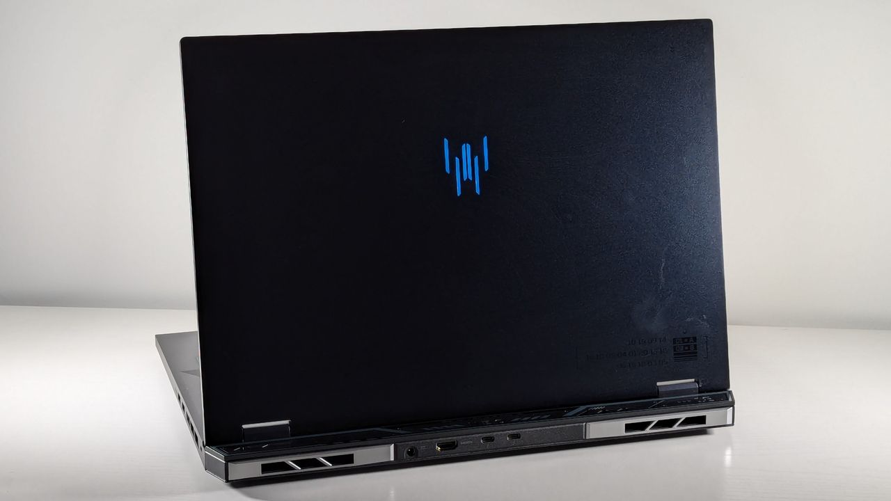 A view of the top lid on an open Acer Predator Helios Neo 18 laptop in front of a light gray background.