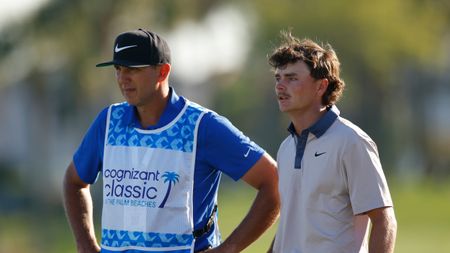 Luke Clanton and his caddie Jason Wiertel look on during the 2025 Cognizant Classic