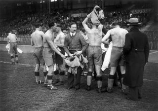 Real Madrid players hand in their jerseys after a match against Parisians in April 1934.