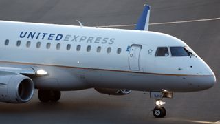United Airlines Embraer 175 taxiing on a runway