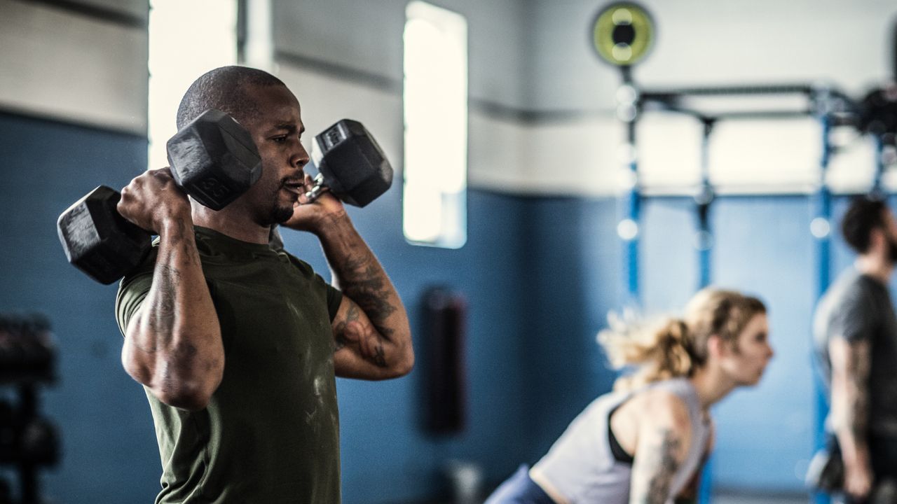 Man exercising with dumbbells 