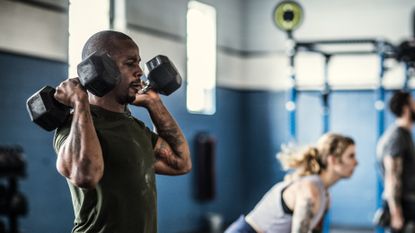 Man exercising with dumbbells 