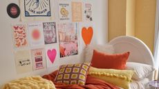 Orange bed with gallery wall art