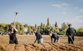 Israel Start-Up Nation riders build a cyclo-cross track during the pre-season training camp