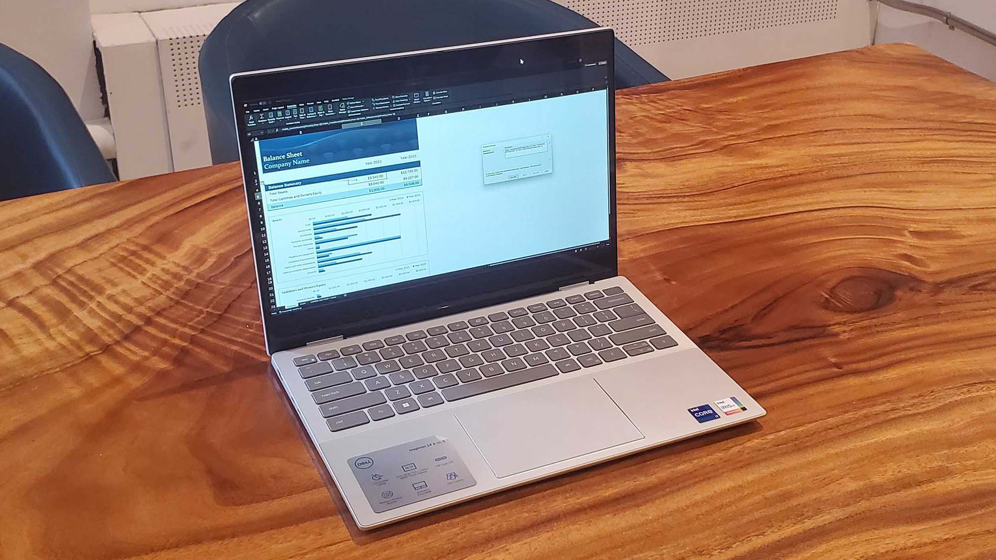 A Dell Inspiron 14 2-in-1 on a wooden table