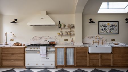 a dark wood kitchen with textured doors plus a big Belfast sink and white range cooker