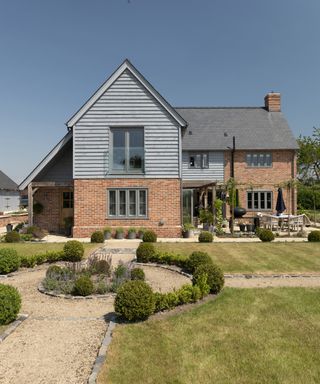 A sleek brick and timber oak frame home. It's detached with two storeys