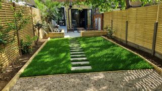 A garden makeover image in a small urban space with a lawn area and pathway and patio