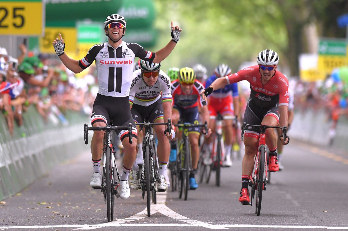 John Degenkolb throws his arm out as Michael Matthews celebrates