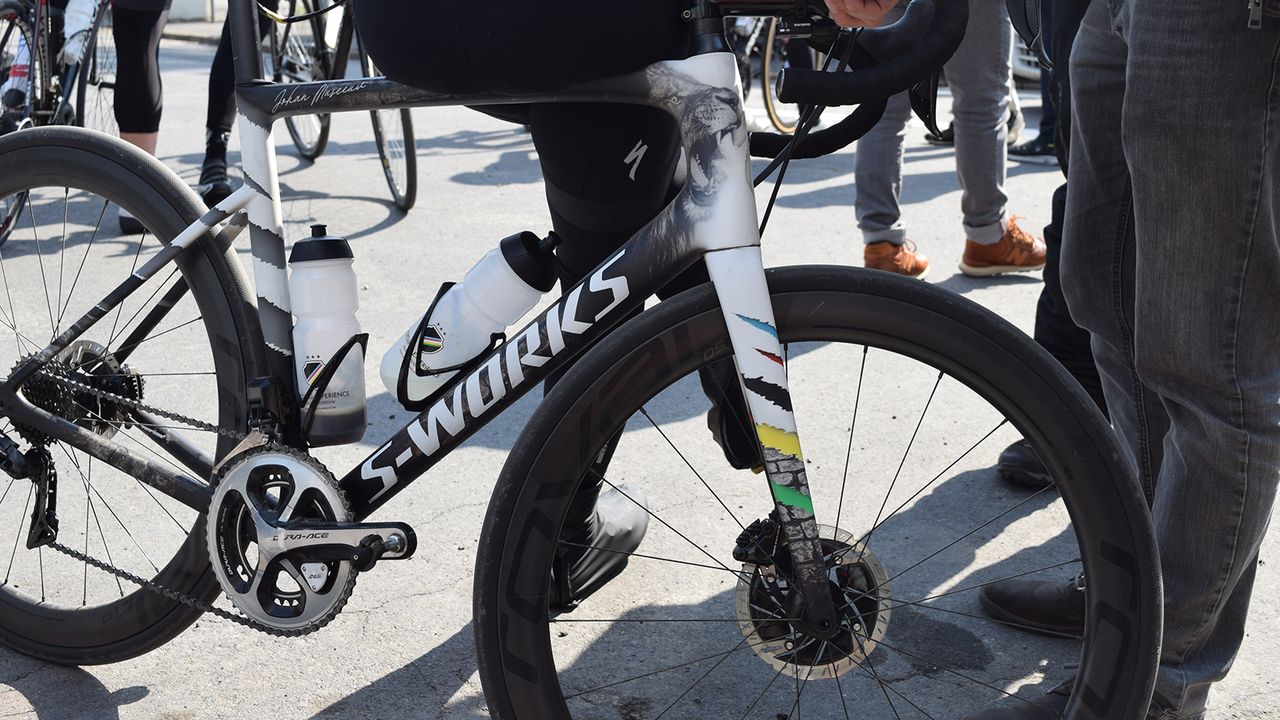 Cobbles and torn graphics in world championship rainbow colours celebrate the Belgian's biggest victories