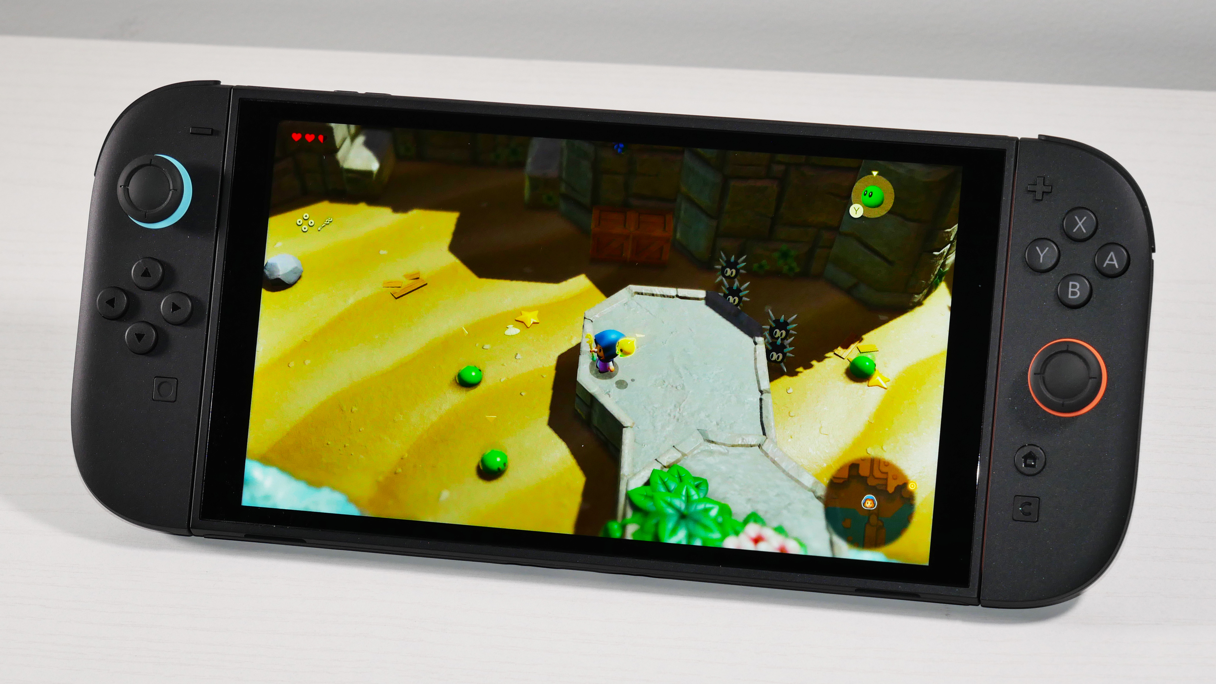 Nintendo Switch 2 laying on a white desk, highlighting its display.