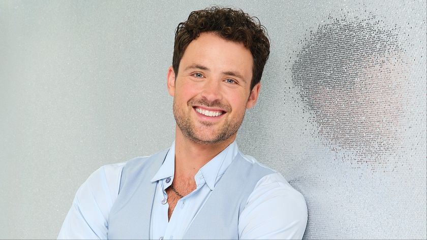 Dylan Efron posing in a suit for Season 34 of ABC&#039;s Dancing with the Stars