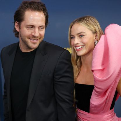 Margot Robbie and Tom Ackerley on the red carpet at the 30th Screen Actors Guild Awards