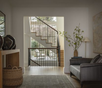 wooden staircase with metal balustrade by Lisa Staton