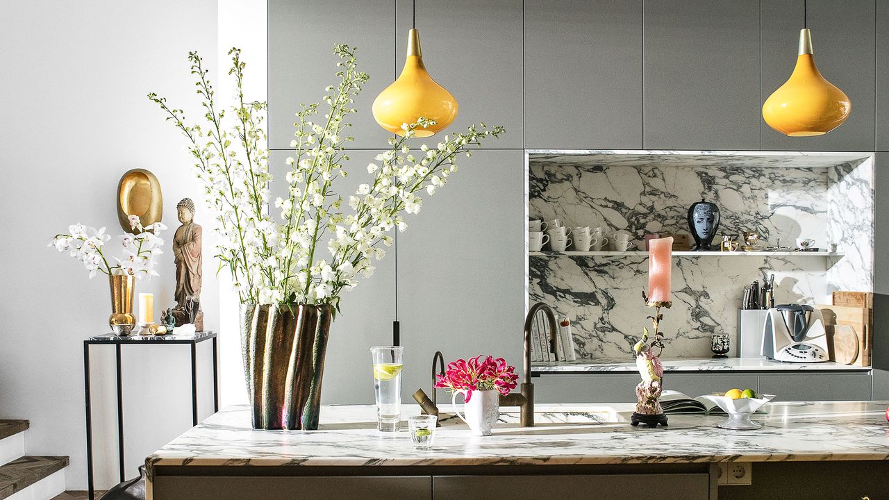 Roost episode 5 - a grey and yellow kitchen with marble splashbacks and kitchen island - Credit-Future