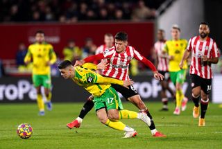 Norwich City’s Milot Rashica (left) and Brentford’s Christian Norgaard battle for the ball during the Premier League match at Brentford Community Stadium, London. Picture date: Saturday November 6, 2021