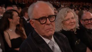 John Lithgow makes a disappointed face in the audience at the 97th Academy Awards.