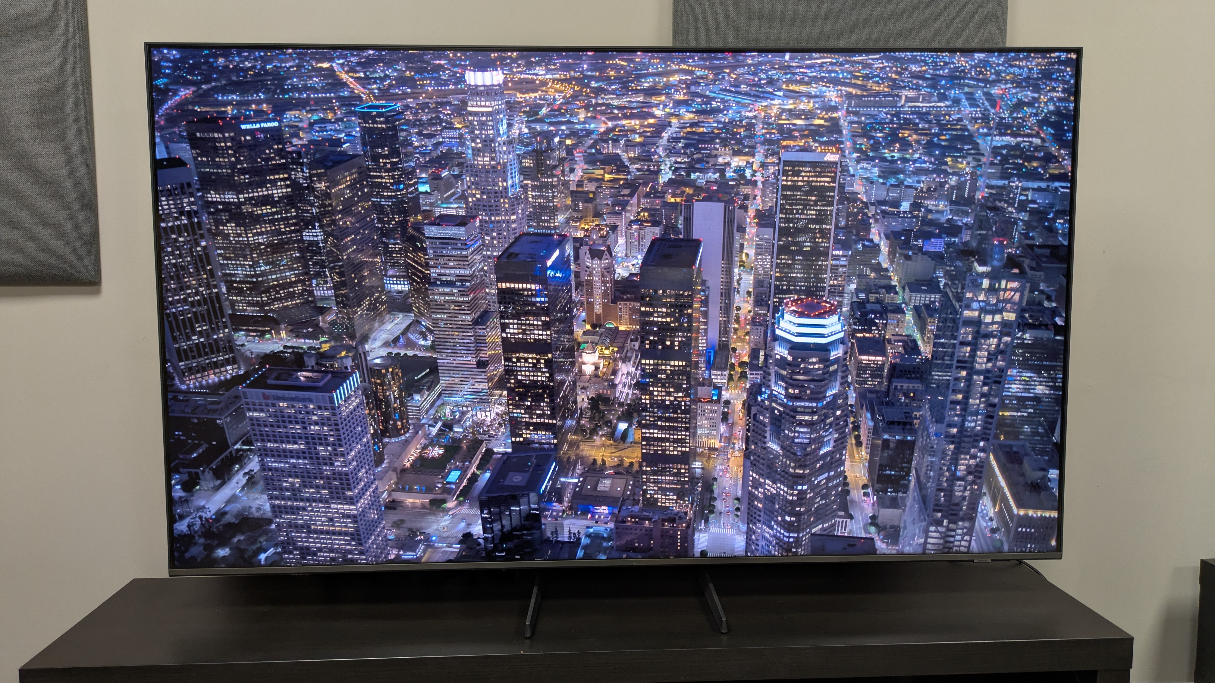 Samsung Q8F with an aerial city shot at night on screen