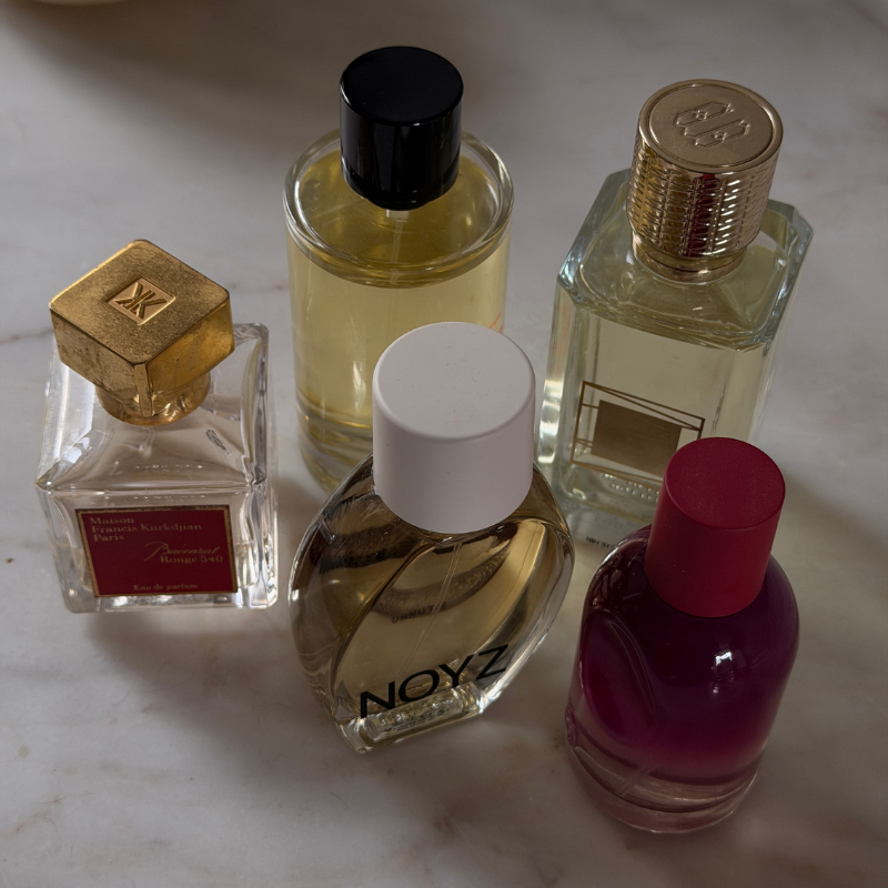 A photo of perfumes bottles featuring nutty fragrances notes