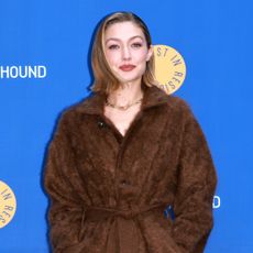 Gigi Hadid wearing a brown coat