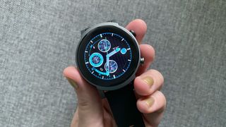 Woman's hand holding the TicWatch E3