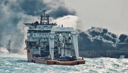 A Japanese rescue vessel fighting flames on board stricken oil tanker