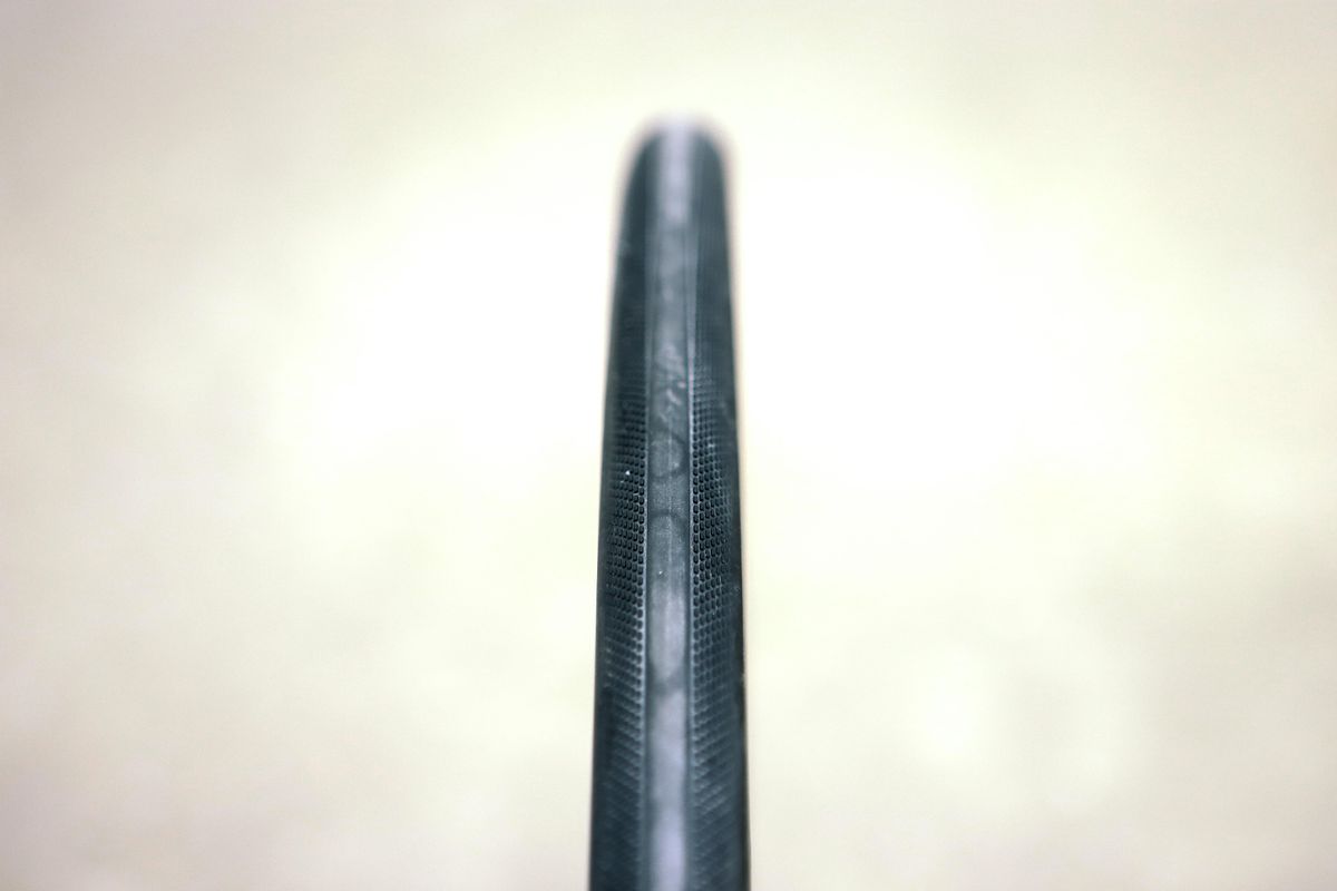 a close up of a black road bike tyre