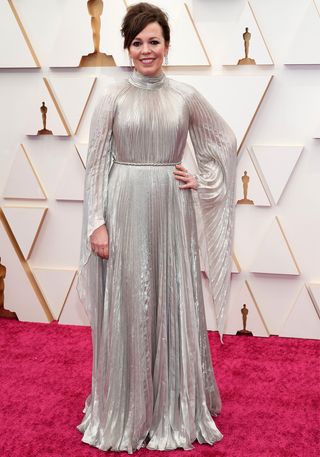 Olivia Colman on the oscars red carpet wearing a silver dress