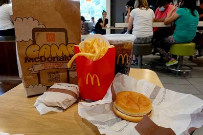 McDonald's food sits on a table in one of the fast food restaurants on July 26, 2022 in Miami, Florida.
