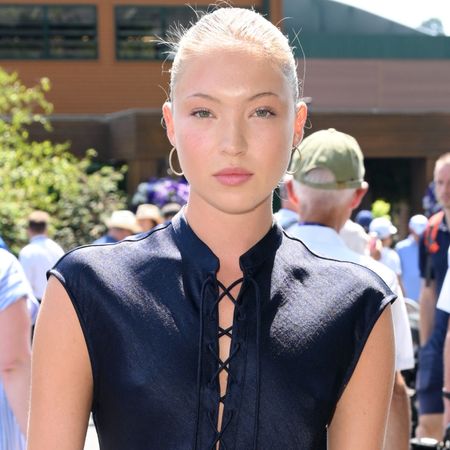 Lila Moss wore a navy blue slip dress from Ralph Lauren to Wimbledon 2025