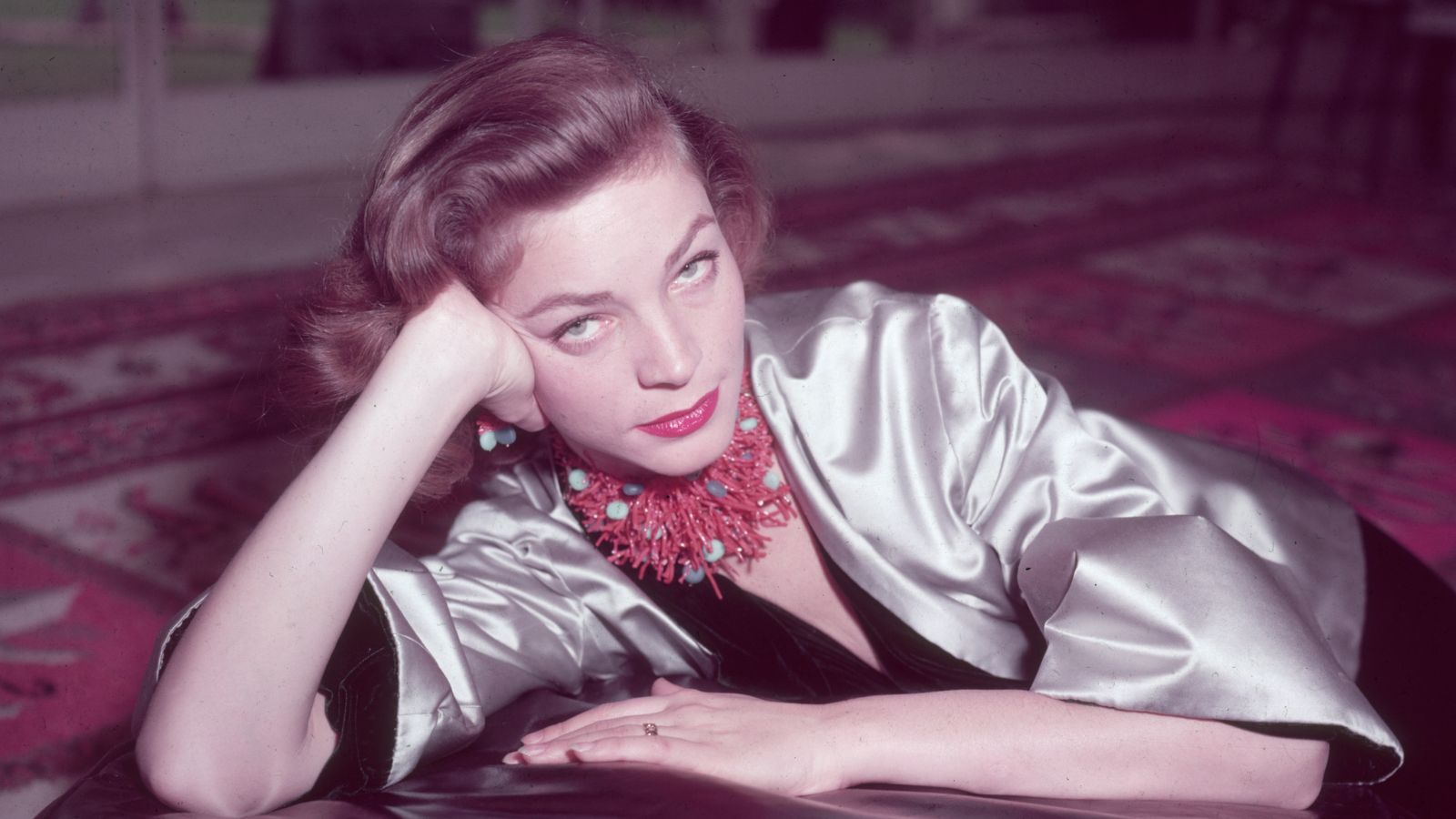 lauren bacall on a persian rug