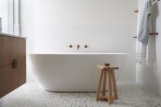 A family bathroom with freestanding tub