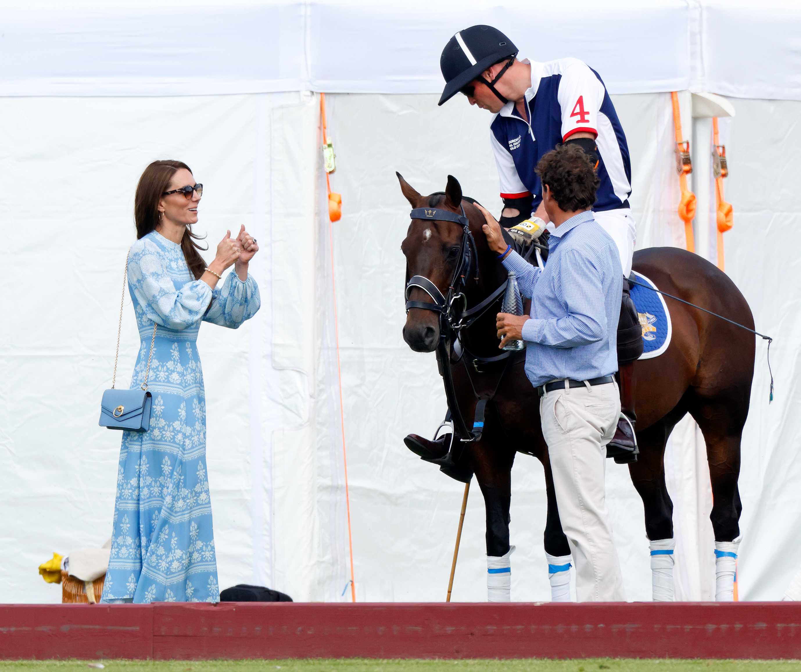 WINDSOR, UNITED KINGDOM - JULY 06: (EMBARGOED FOR PUBLICATION IN UK NEWSPAPERS UNTIL 24 HOURS AFTER CREATE DATE AND TIME) Catherine, Princess of Wales gives thumbs up to Prince William, Prince of Wales as he plays in the Out-Sourcing Inc. Royal Charity Polo Cup 2023 at Guards Polo Club, Flemish Farm on July 6, 2023 in Windsor, England. (Photo by Max Mumby/Indigo/Getty Images)