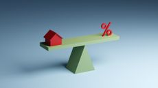 Illustration of a small red model house balancing on a seesaw opposite a red percentage sign